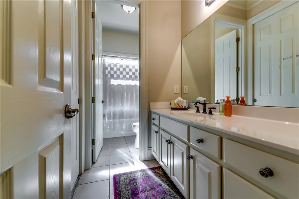 Full bathroom on the main level connected to office or 6th bedroom.