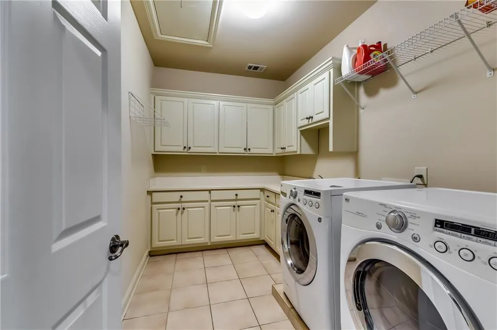 Spacious laundry room on upper level.