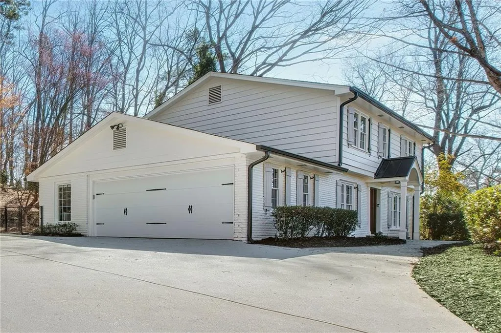 View of side of home featuring a garage