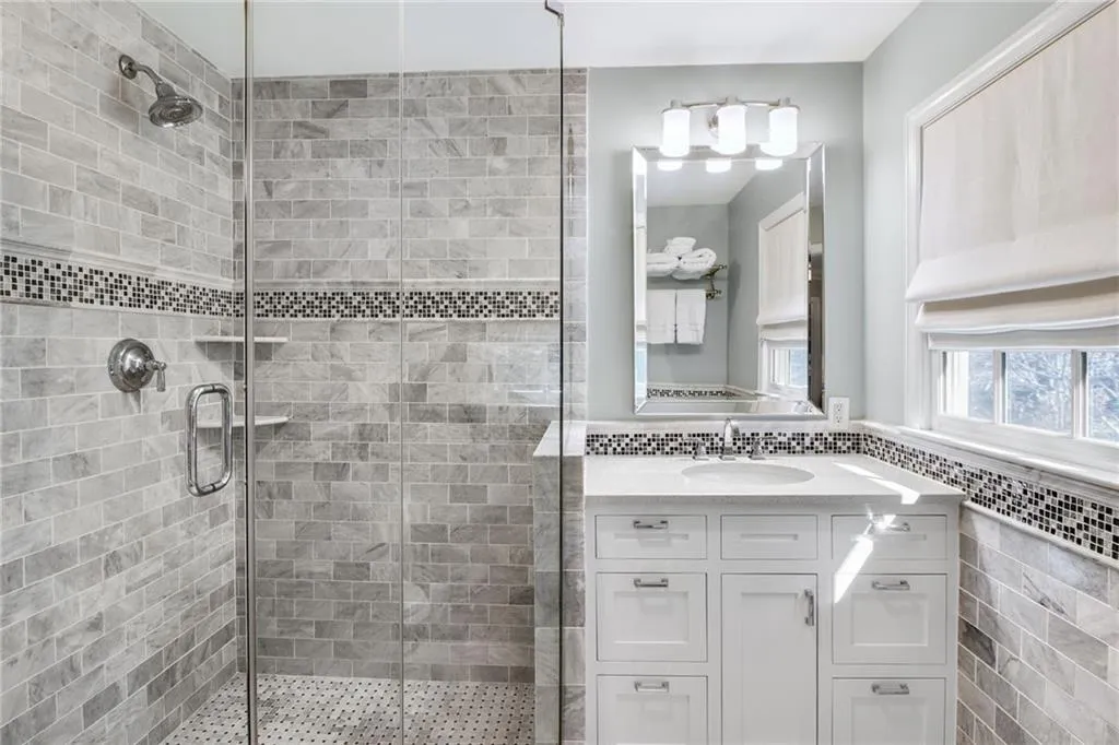 Bathroom featuring vanity and walk in shower