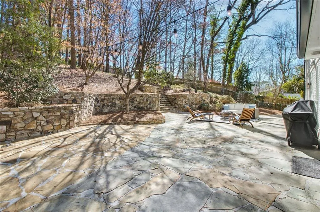 View of patio with an outdoor hangout area