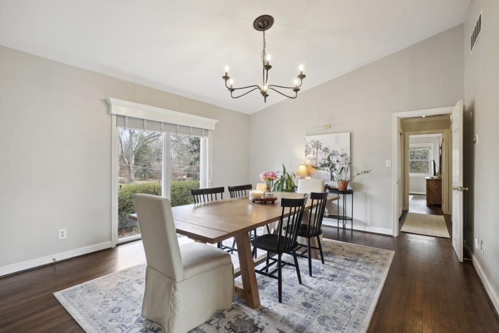Oversized Formal Dining space Lined with Windows.