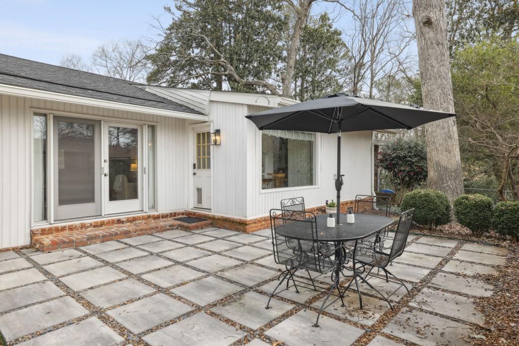The Backyard is Fully Fenced and Low Maintenanced with the Perfect Mix of Patio of Pavers and Grass.