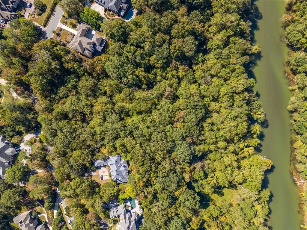 Aerial overview of property's location with a nearby body of water