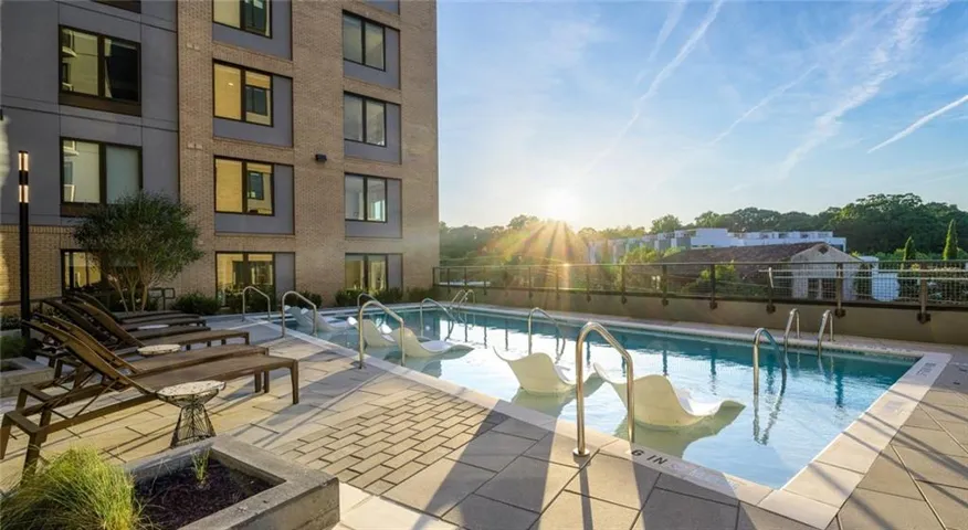 Community pool with a patio area