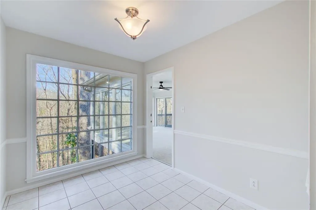 Beautiful floor to ceiling windows in this eat in kitchen