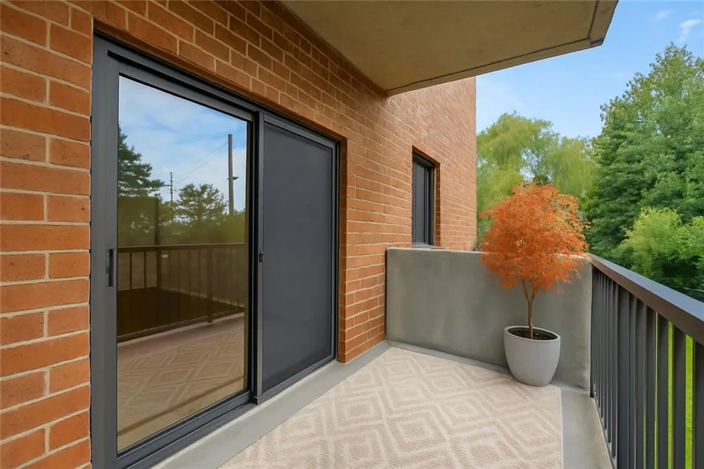 Virtually staged balcony off primary bedroom