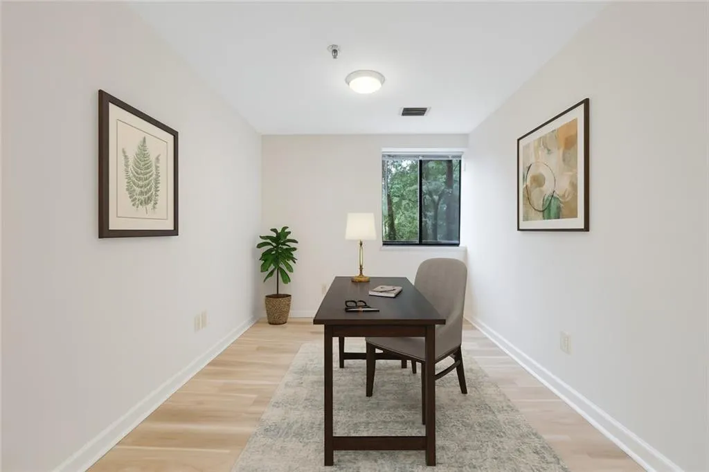 Virtually staged photo of flex room that would be ideal as office, craft room or play space for visiting grandkids