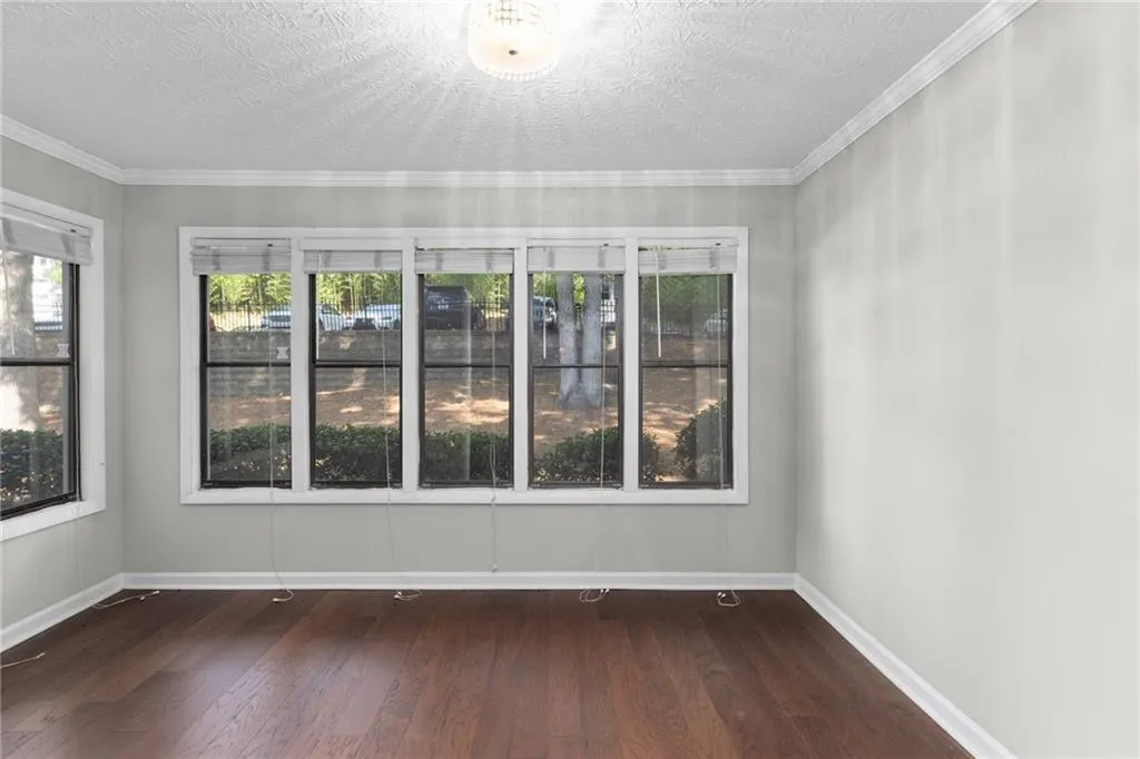 Unfurnished sunroom featuring plenty of natural light