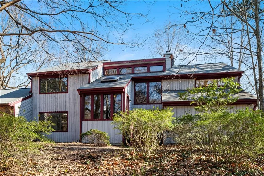 View of front of home featuring a chimney