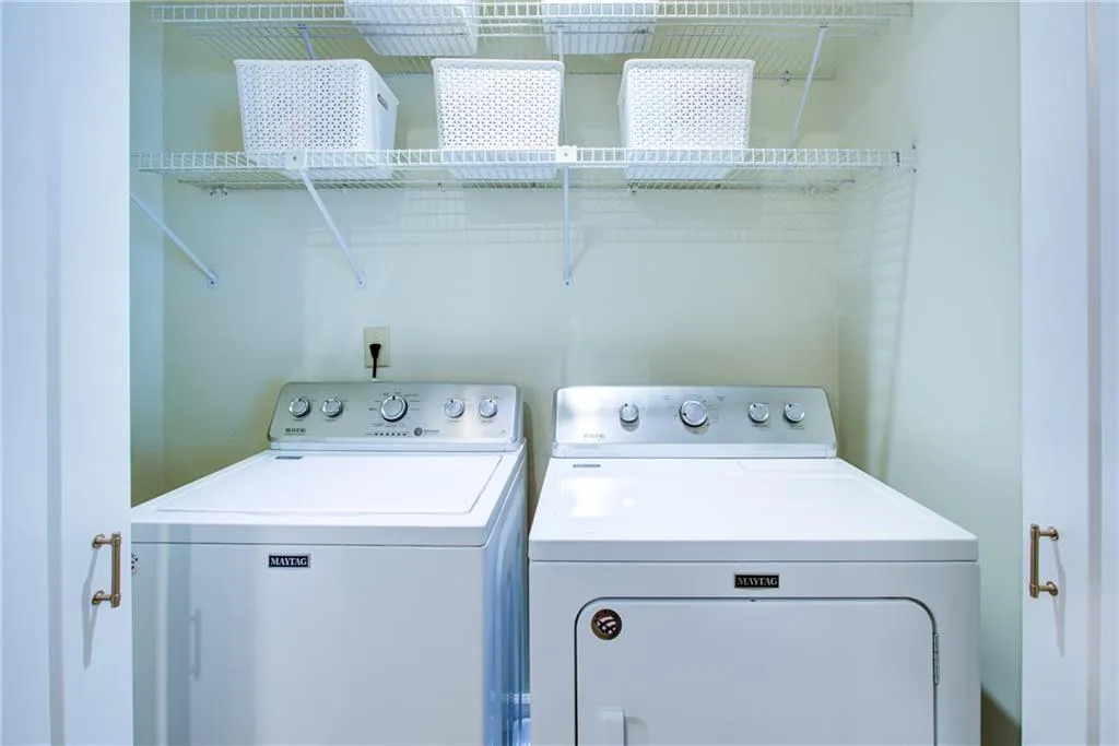 Washroom featuring separate washer and dryer