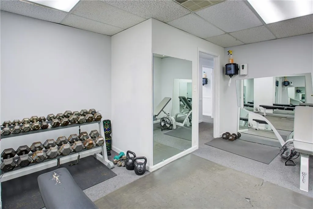 Exercise area with a paneled ceiling