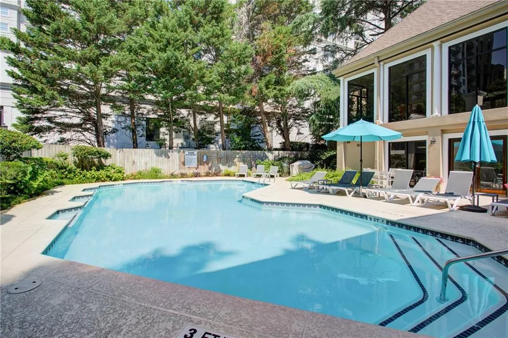 Community pool featuring a patio area