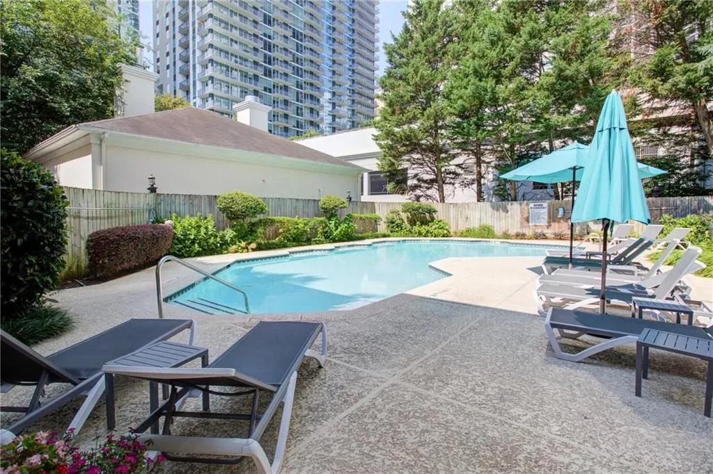 View of pool featuring a patio and a fenced backyard