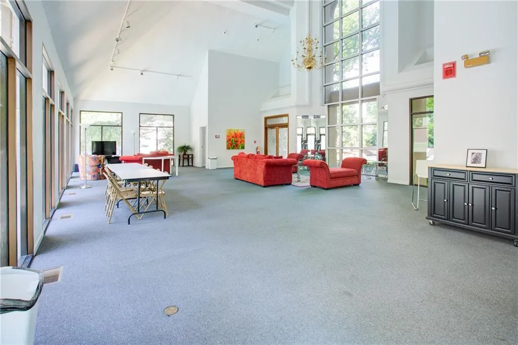 Common area with high vaulted ceiling