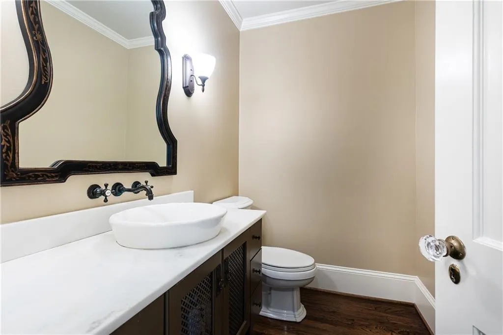 Half bathroom on the main level offers hospitality and comfort.