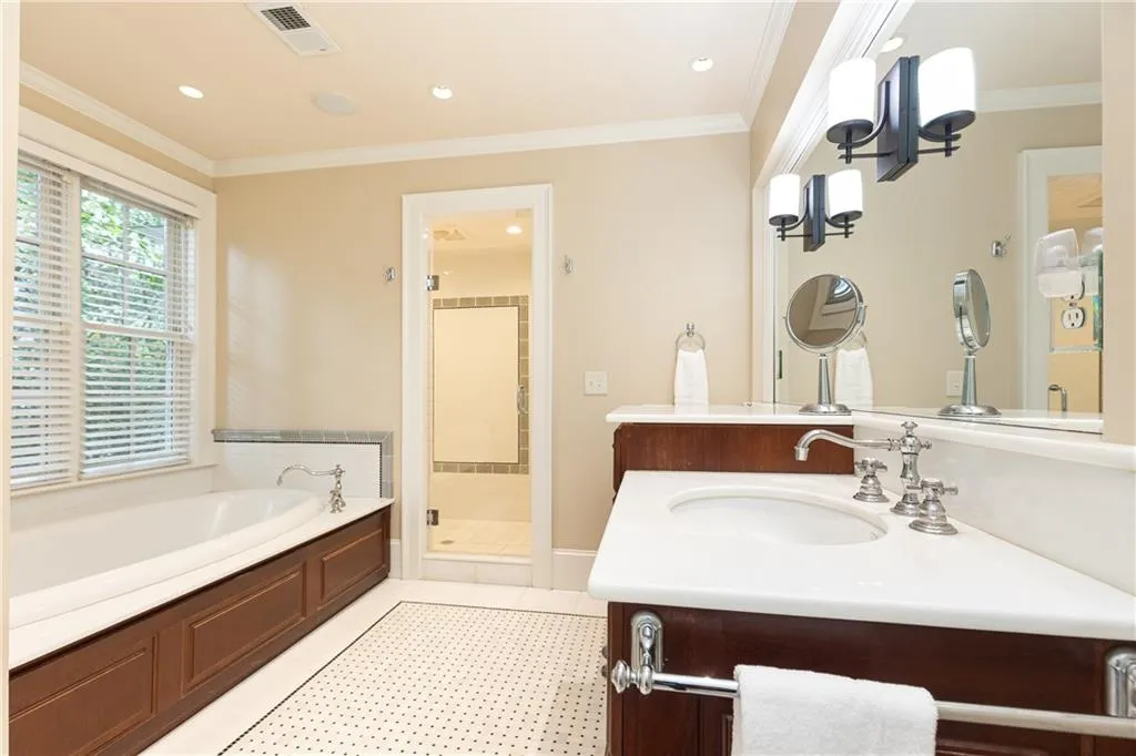 This generous primary bathroom makes for a nice retreat with it's large soaking tub.