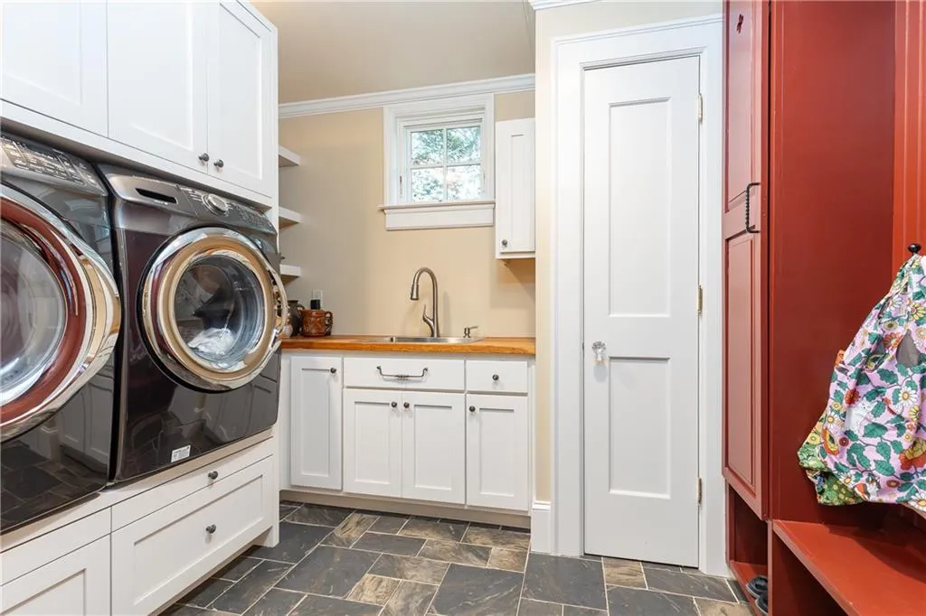 This well-equipped laundry room is conveniently located adjacent to the kitchen.