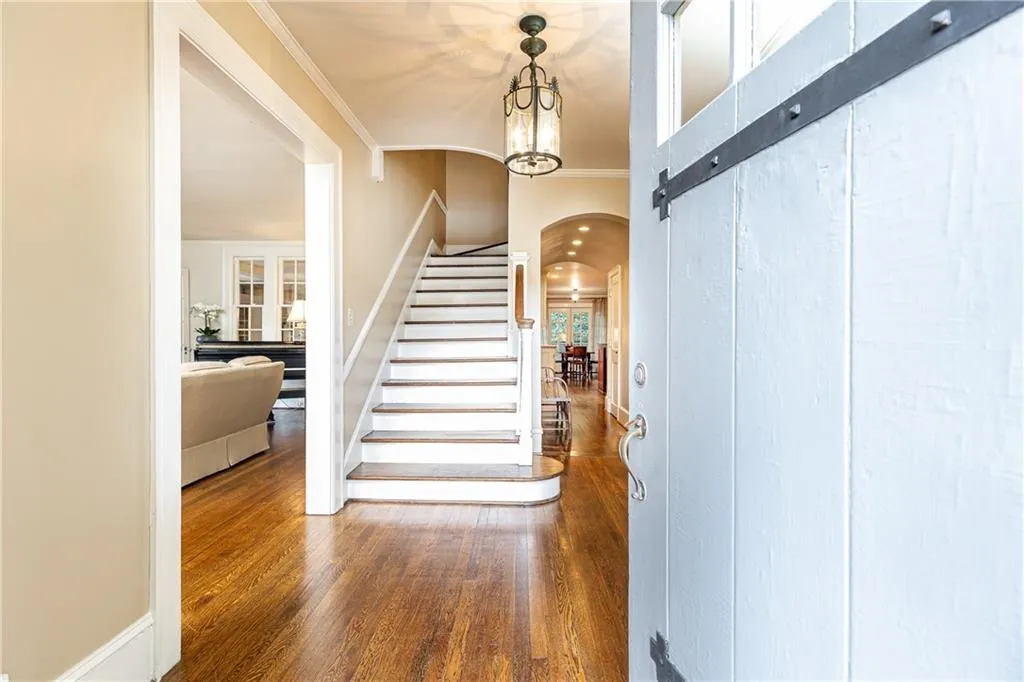 Step into this classic Brookwood Hills style home designed in an era that blends luxury and comfort seamlessly.