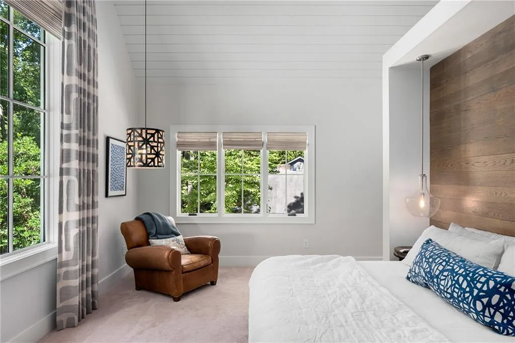 Bedroom featuring carpet floors and baseboards