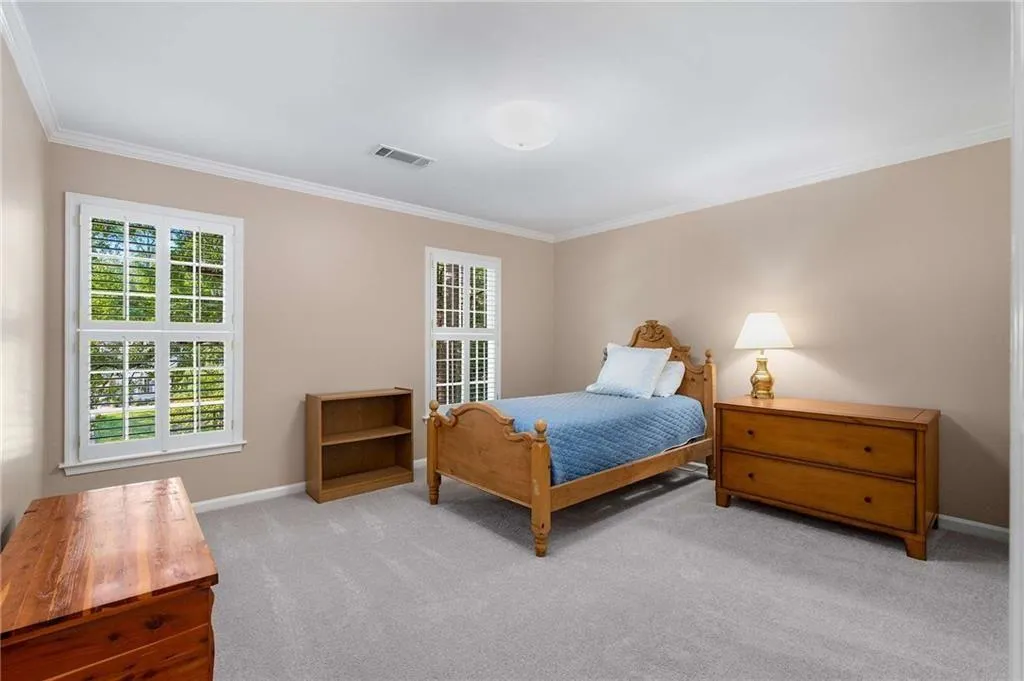 Carpeted - brand new - bedroom with ornamental molding