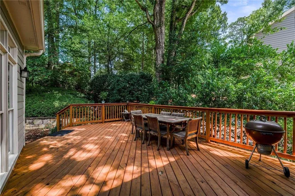 New large Deck featuring outdoor dining space and area for grilling
