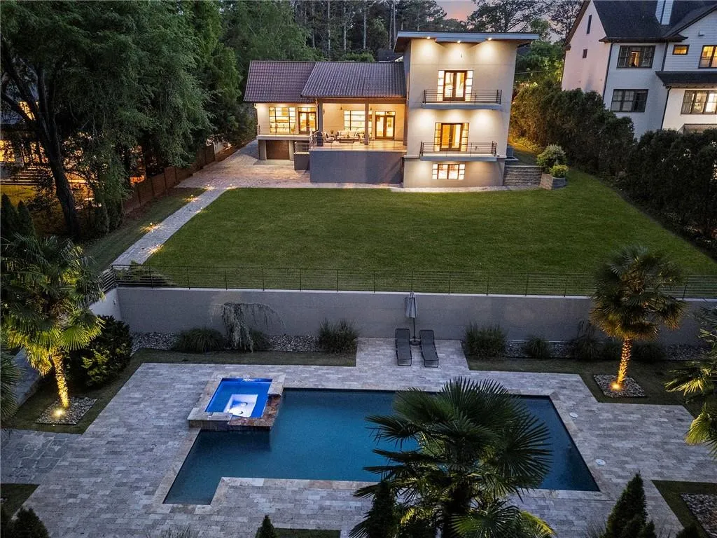 Flat lawn and pool with spa.