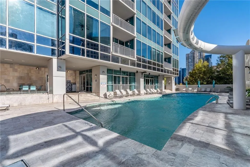 Community pool featuring a patio area