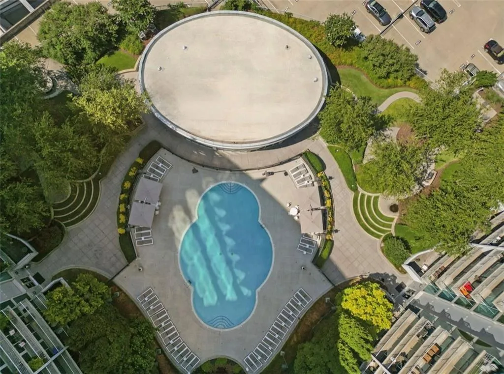 Aerial overview of property's location with a pool area