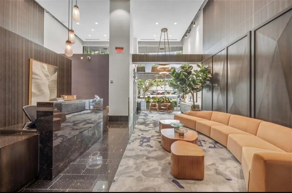 Common area featuring a high ceiling and recessed lighting
