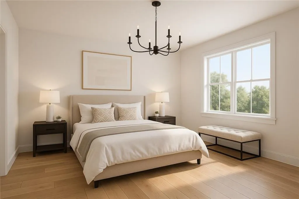 Bedroom featuring a chandelier and light wood finished floors