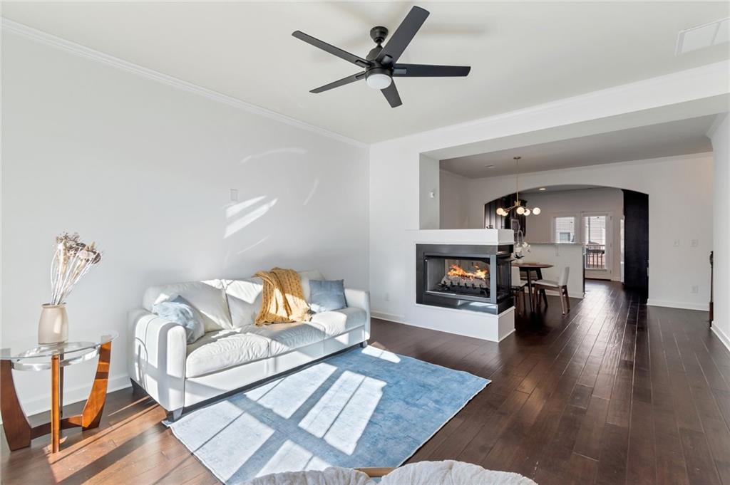 Bright, sunny and spacious living room with two sided fire place Bright, sunny and spacious living room with two sided fire place