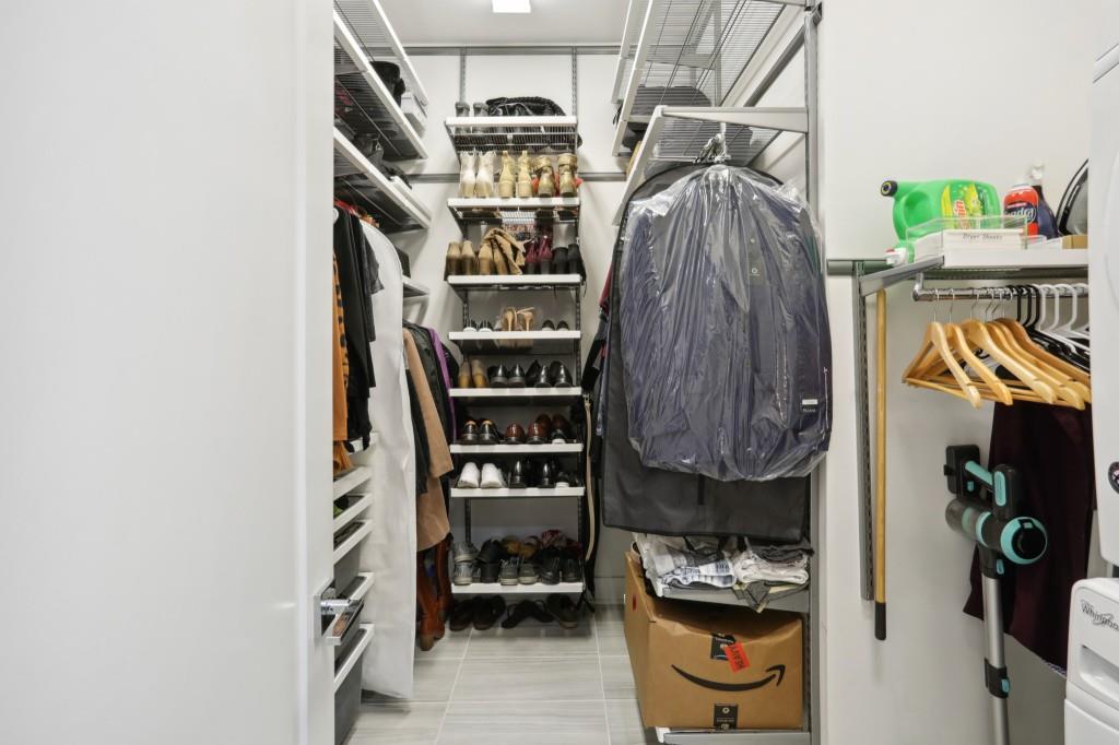 Walk-In Closet With Custom Elfa Shelving System