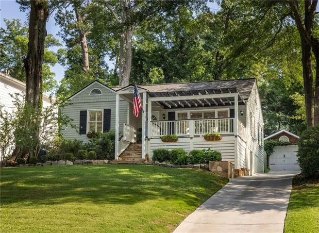 Charming Peachtree Hills cottage on a sunny knoll.