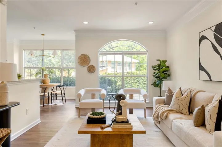Welcome to #215! Incredibly bright property that is the second largest floor plan with private 1-car garage!