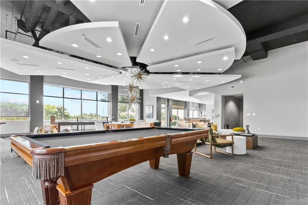 Playroom featuring recessed lighting, pool table, and a high ceiling Playroom featuring recessed lighting, pool table, and a high ceiling