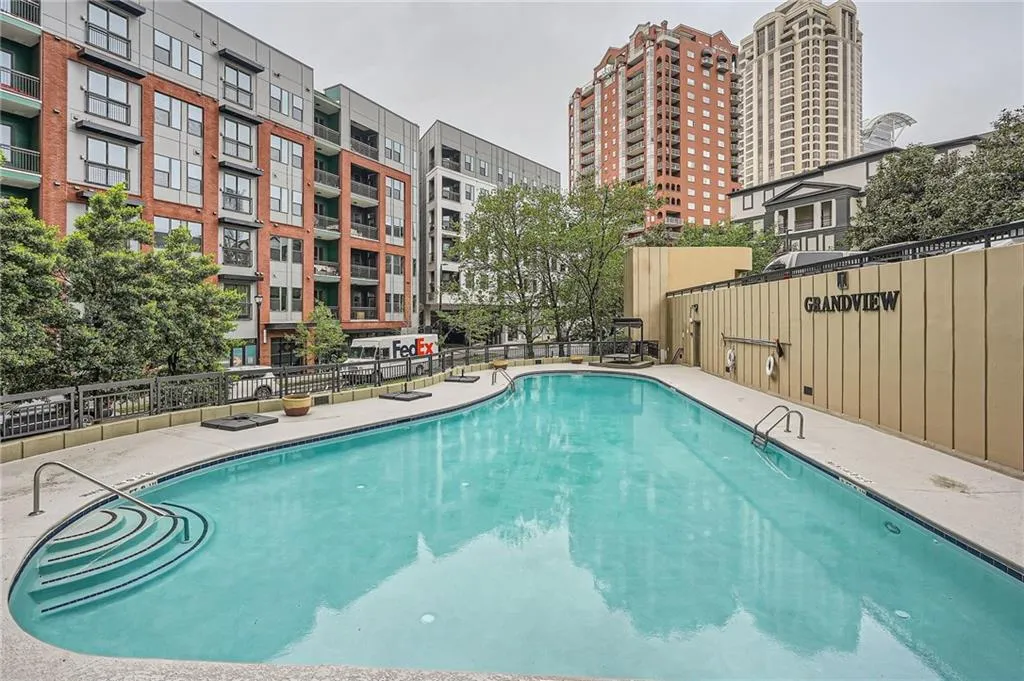 Community pool featuring fence