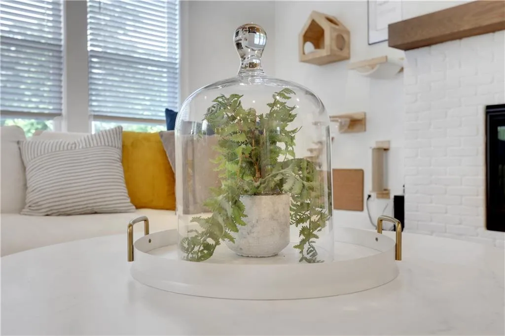 White-painted brick fireplace with a wood mantle