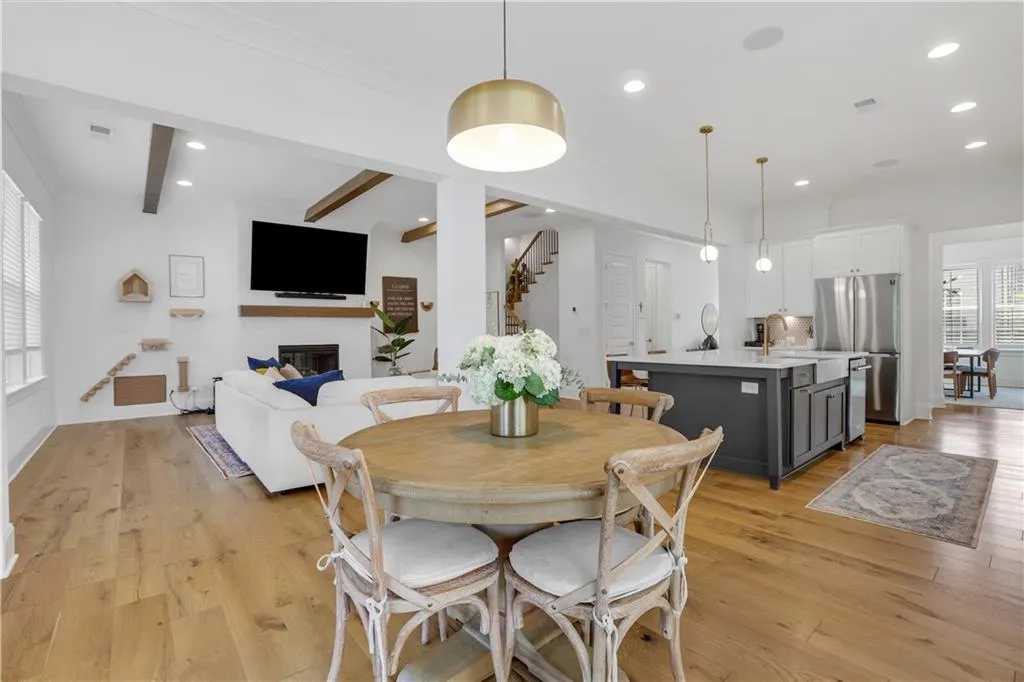 Open-concept main living area with wood-finish flooring