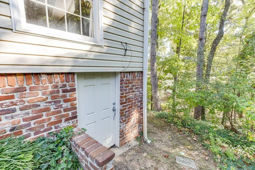 Property entrance with brick siding