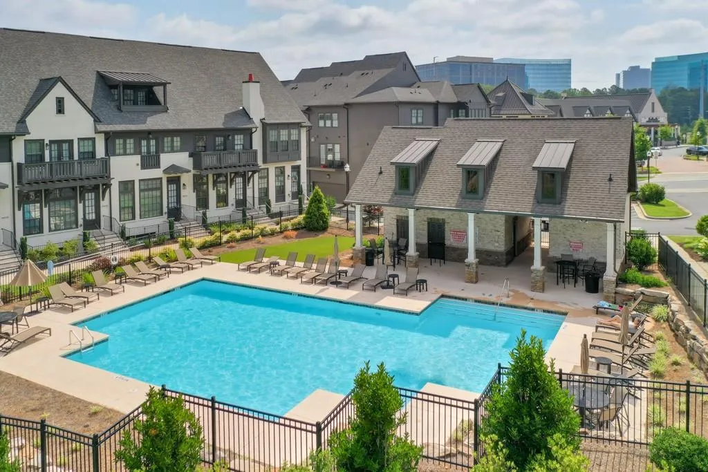 Community pool featuring a patio, and fence