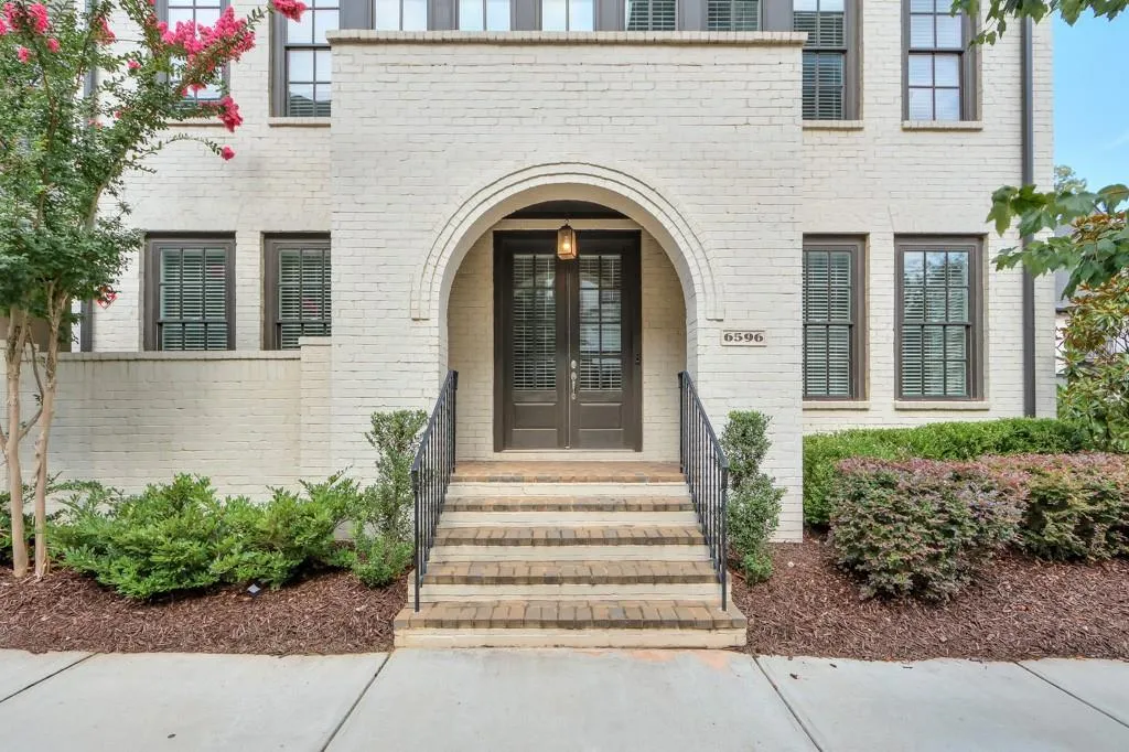 Doorway to property with brick siding and french doors