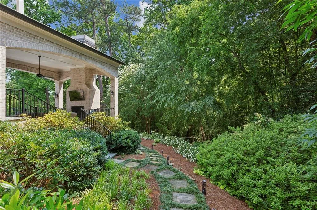 View of side yard featuring covered porch