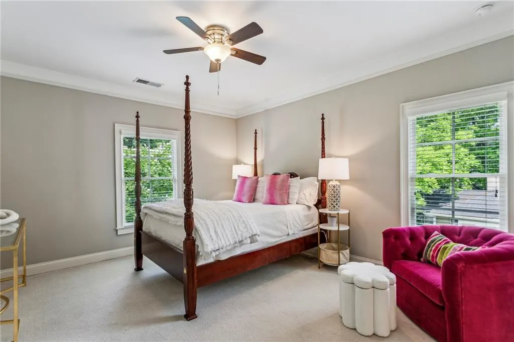 Bedroom #2 upstairs with crown molding, baseboards, carpet floors, and a ceiling fan shares large bathroom