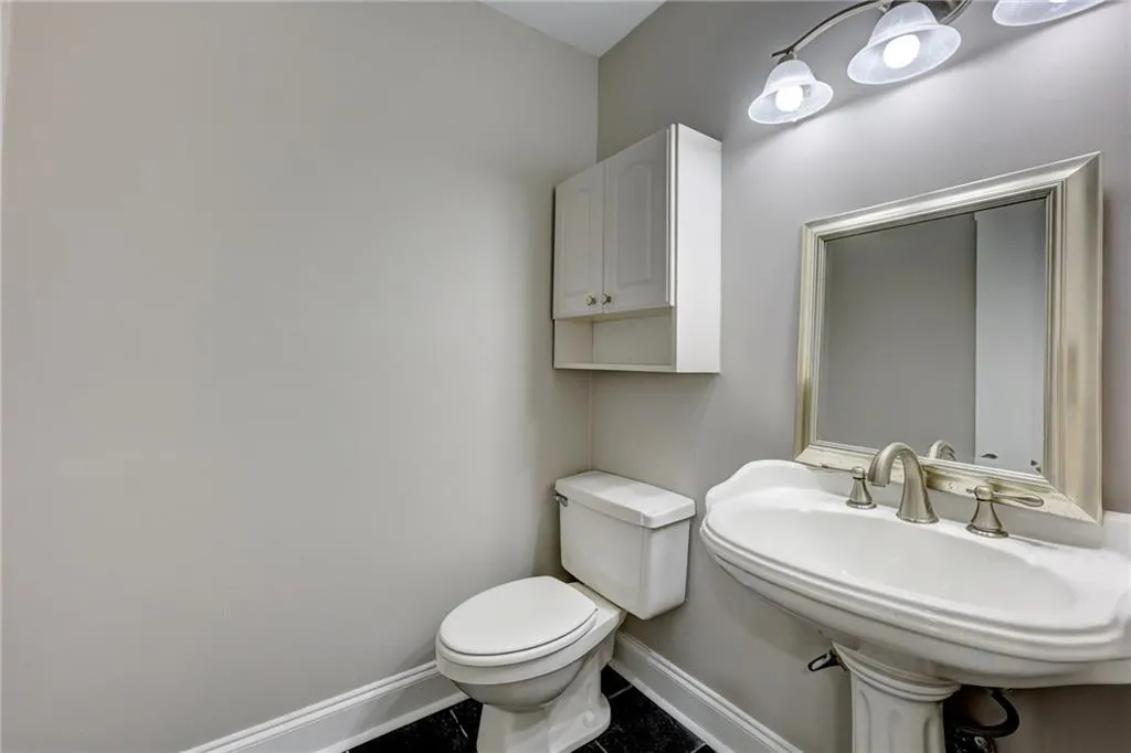Bathroom featuring baseboards and tile patterned floors