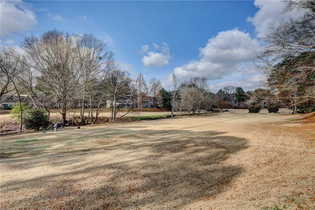 View of yard with view of wooded area