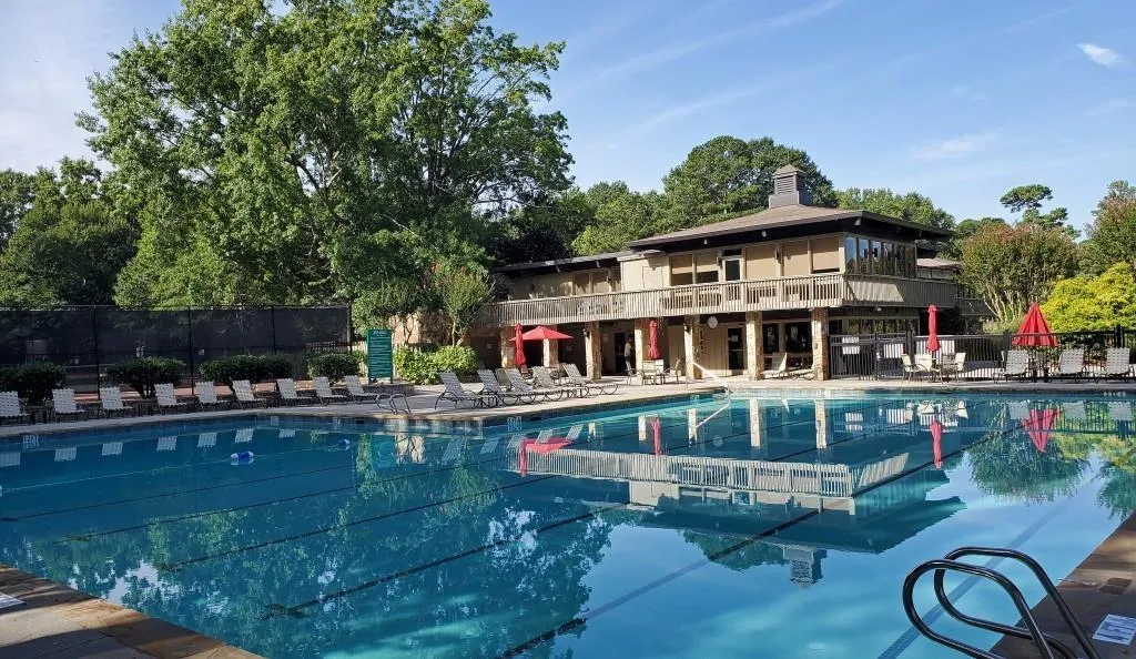 Community pool with a patio and a balcony