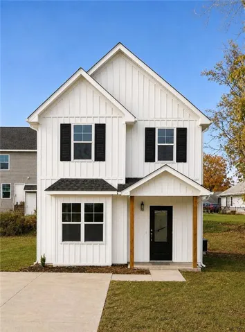Modern farmhouse exterior featuring white board and batten siding