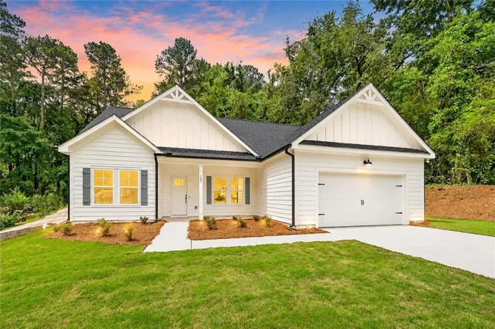 White siding exterior with dark shutters