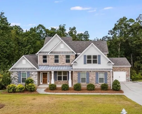 Stone and siding exterior with multiple gables